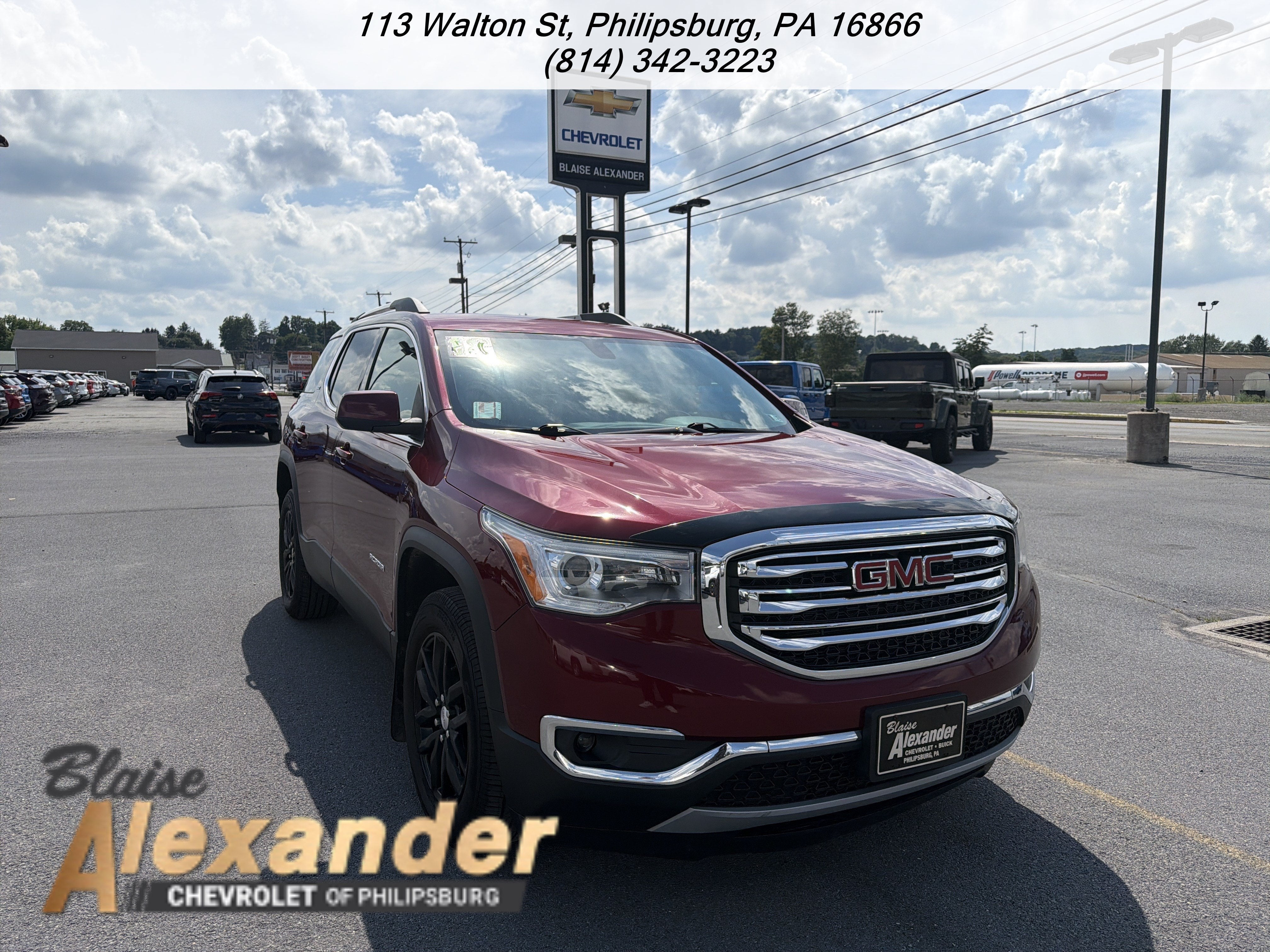 2018 GMC Acadia SLT in Crimson Red Tintcoat — front three-quarter view
