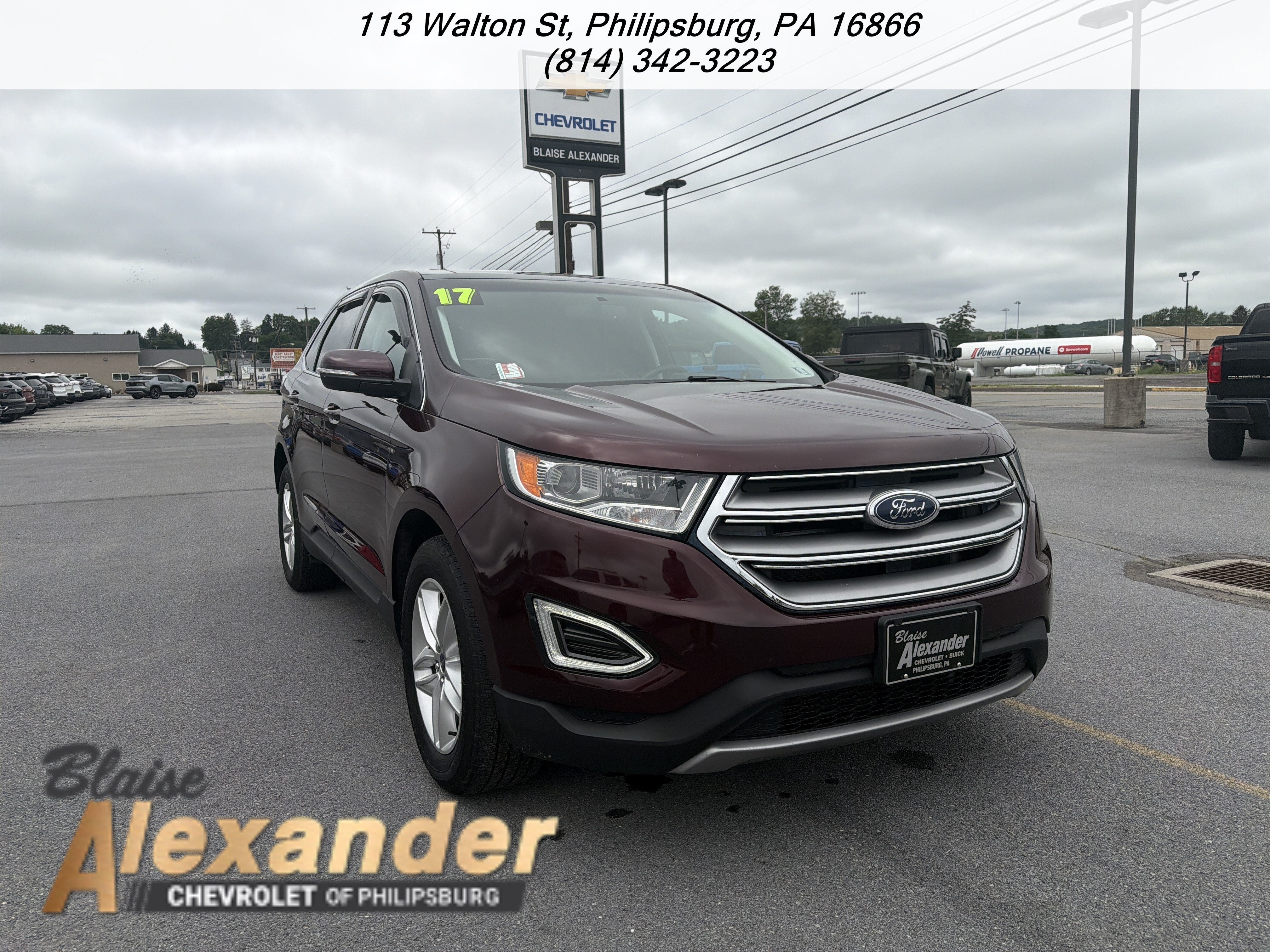 2017 Ford Edge SEL in Red — front three-quarter view