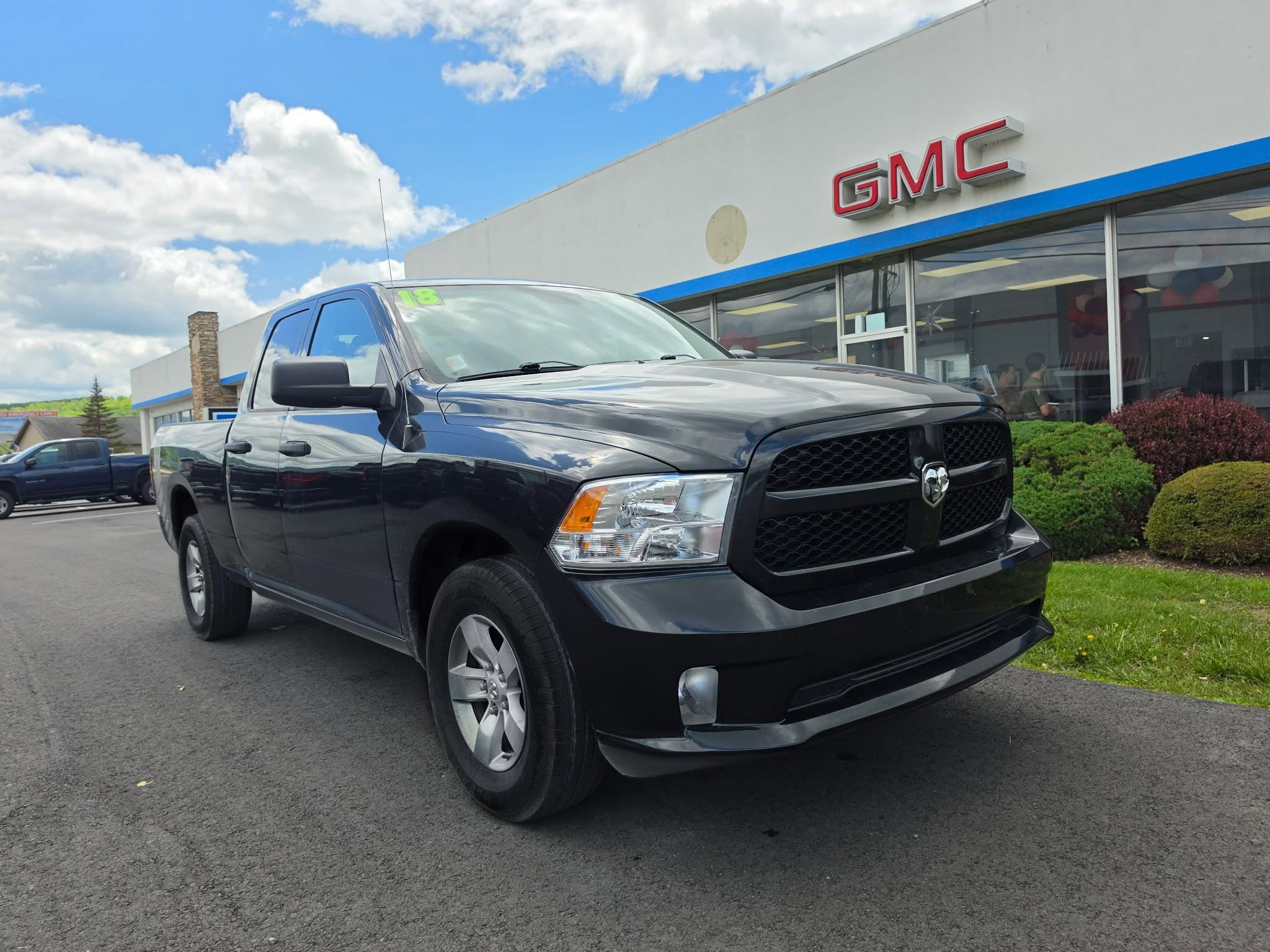 2018 RAM 1500 Express in Brilliant Black Crystal Pearlcoat — front three-quarter view
