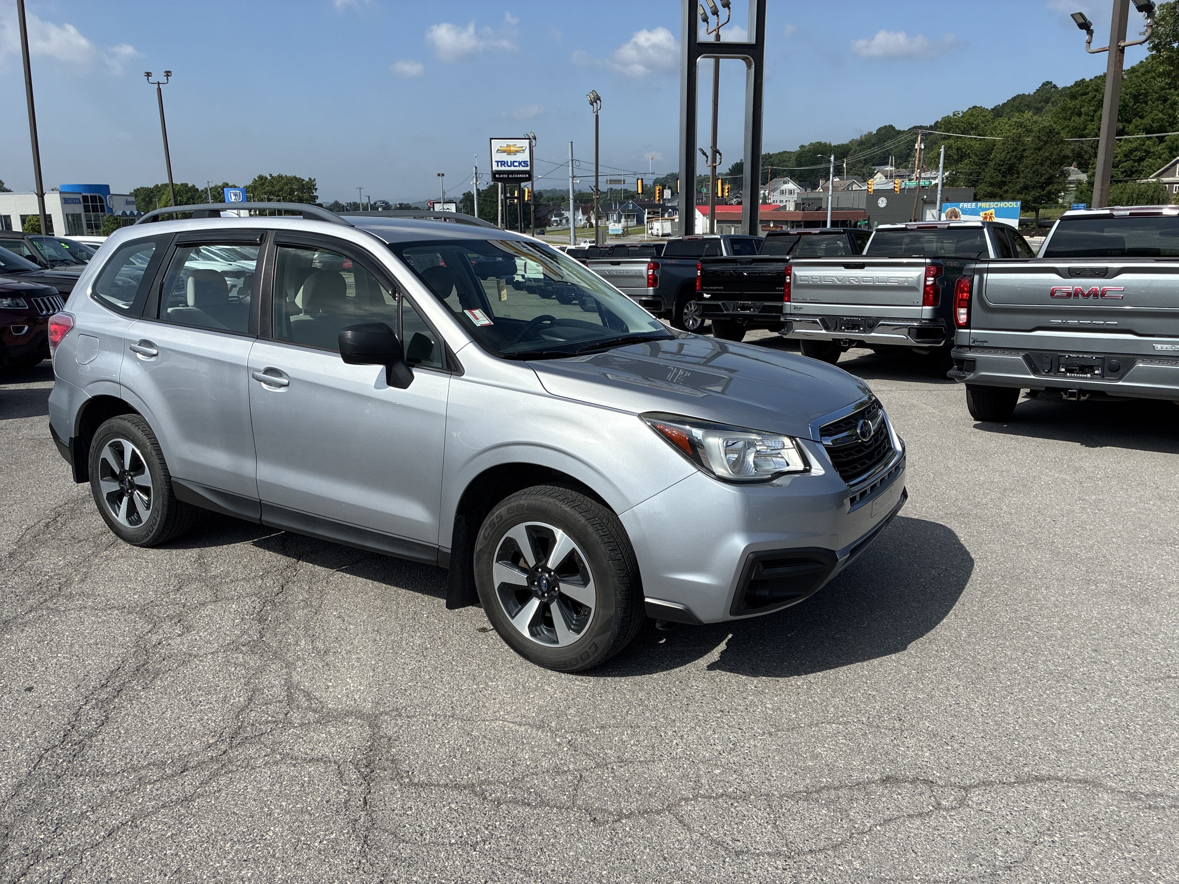 2018 Subaru Forester 2.5i in Ice Silver Metallic — front three-quarter view